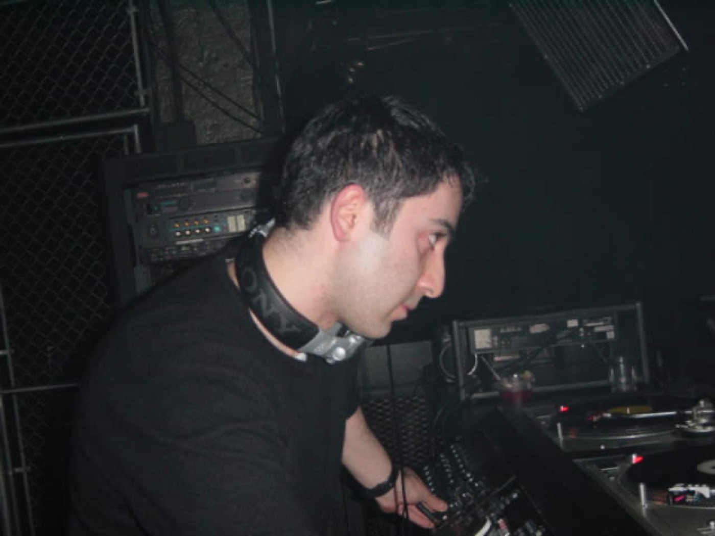 A DJ at the decks at Axis, Boston